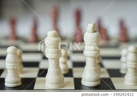 Close-up of white chess pieces on chessboard Close-up of white chess pieces on chessboard 140281422