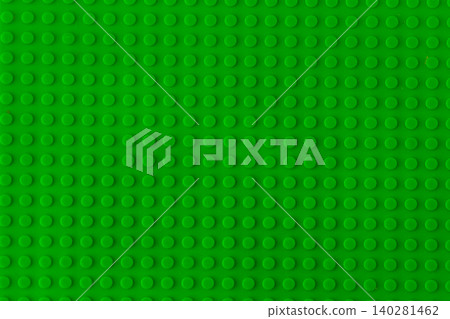 Green plastic building blocks baseplate texture, top view toy brick board pattern background. Green plastic building blocks baseplate texture, top view toy brick board pattern background. 140281462