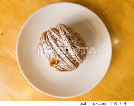 A delectable slice of cake with rich layers of cream and frosting, topped with fresh fruit or sprinkles. Perfect for dessert photography, showcasing indulgence and sweetness in food-related projects. 140281464