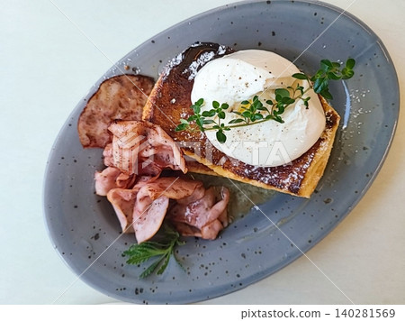 Golden, crispy toast topped with butter and jam, perfect for breakfast or snack-related projects. This image captures the warmth and comfort of a simple yet satisfying meal. 140281569