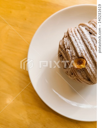 A delectable slice of cake with rich layers of cream and frosting, topped with fresh fruit or sprinkles. Perfect for dessert photography, showcasing indulgence and sweetness in food-related projects. 140281619