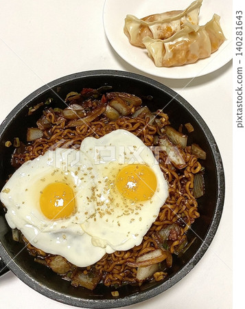 A classic Korean-Chinese combo of jajangmyeon with thick, chewy noodles coated in rich black bean sauce, served alongside crispy tangsuyuk, deep-fried pork with sweet and sour sauce. A classic Korean-Chinese combo of jajangmyeon with thick, chewy noodles coated in rich black bean sauce, served alongside crispy tangsuyuk, deep-fried pork with sweet and sour sauce. 140281643