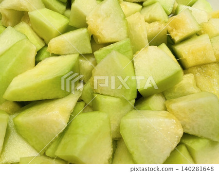 Fresh melon cubes neatly arranged in a bowl, showcasing their vibrant orange and green hues. A refreshing and visually appealing treat, perfect for any occasion. Fresh melon cubes neatly arranged in a bowl, showcasing their vibrant orange and green hues. A refreshing and visually appealing treat, perfect for any occasion. 140281648