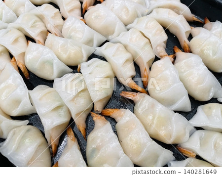 Korean dumplings filled with a mix of savory ingredients like ground meat, tofu, and vegetables. Mandu can be steamed, boiled, or pan-fried, making it a versatile and delicious snack or meal. Korean dumplings filled with a mix of savory ingredients like ground meat, tofu, and vegetables. Mandu can be steamed, boiled, or pan-fried, making it a versatile and delicious snack or meal. 140281649