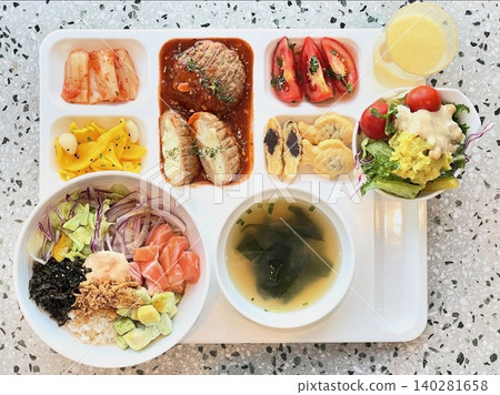 A vibrant spread of Korean food on the table, featuring various banchan (side dishes) like kimchi, pickled vegetables, and seasoned greens. Perfect for food photography, showcasing traditional Korean. 140281658