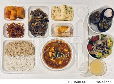 A vibrant spread of Korean food on the table, featuring various banchan (side dishes) like kimchi, pickled vegetables, and seasoned greens. Perfect for food photography, showcasing traditional Korean. A vibrant spread of Korean food on the table, featuring various banchan (side dishes) like kimchi, pickled vegetables, and seasoned greens. Perfect for food photography, showcasing traditional Korean. 140281662