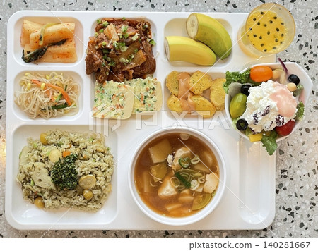 A vibrant spread of Korean food on the table, featuring various banchan (side dishes) like kimchi, pickled vegetables, and seasoned greens. Perfect for food photography, showcasing traditional Korean. 140281667