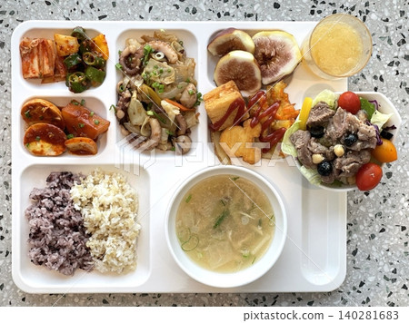 A vibrant spread of Korean food on the table, featuring various banchan (side dishes) like kimchi, pickled vegetables, and seasoned greens. Perfect for food photography, showcasing traditional Korean. A vibrant spread of Korean food on the table, featuring various banchan (side dishes) like kimchi, pickled vegetables, and seasoned greens. Perfect for food photography, showcasing traditional Korean. 140281683