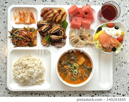 A vibrant spread of Korean food on the table, featuring various banchan (side dishes) like kimchi, pickled vegetables, and seasoned greens. Perfect for food photography, showcasing traditional Korean. A vibrant spread of Korean food on the table, featuring various banchan (side dishes) like kimchi, pickled vegetables, and seasoned greens. Perfect for food photography, showcasing traditional Korean. 140281695