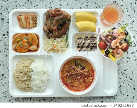 A vibrant spread of Korean food on the table, featuring various banchan (side dishes) like kimchi, pickled vegetables, and seasoned greens. Perfect for food photography, showcasing traditional Korean. A vibrant spread of Korean food on the table, featuring various banchan (side dishes) like kimchi, pickled vegetables, and seasoned greens. Perfect for food photography, showcasing traditional Korean. 140281698