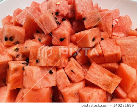 Fresh red watermelon cubes, juicy and refreshing, perfect for a sweet, hydrating snack or as a colorful addition to salads and fruit bowls. A summer favorite that offers natural sweetness. Fresh red watermelon cubes, juicy and refreshing, perfect for a sweet, hydrating snack or as a colorful addition to salads and fruit bowls. A summer favorite that offers natural sweetness. 140281699
