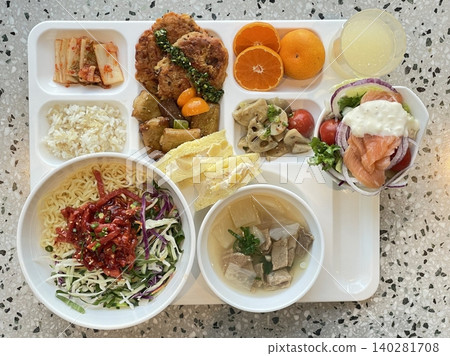 A vibrant spread of Korean food on the table, featuring various banchan (side dishes) like kimchi, pickled vegetables, and seasoned greens. Perfect for food photography, showcasing traditional Korean. A vibrant spread of Korean food on the table, featuring various banchan (side dishes) like kimchi, pickled vegetables, and seasoned greens. Perfect for food photography, showcasing traditional Korean. 140281708