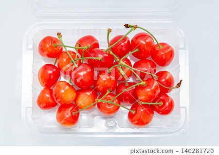Cherries (Sato Nishiki variety) in a pack [White background, cutout] 140281720