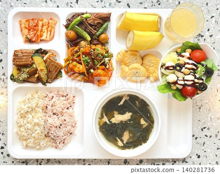 A vibrant spread of Korean food on the table, featuring various banchan (side dishes) like kimchi, pickled vegetables, and seasoned greens. Perfect for food photography, showcasing traditional Korean. 140281736