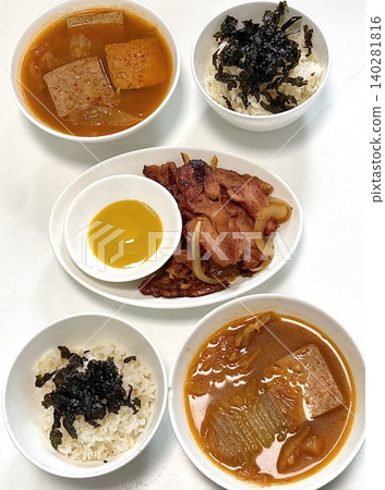 A vibrant spread of Korean food on the table, featuring various banchan (side dishes) like kimchi, pickled vegetables, and seasoned greens. Perfect for food photography, showcasing traditional Korean. A vibrant spread of Korean food on the table, featuring various banchan (side dishes) like kimchi, pickled vegetables, and seasoned greens. Perfect for food photography, showcasing traditional Korean. 140281816