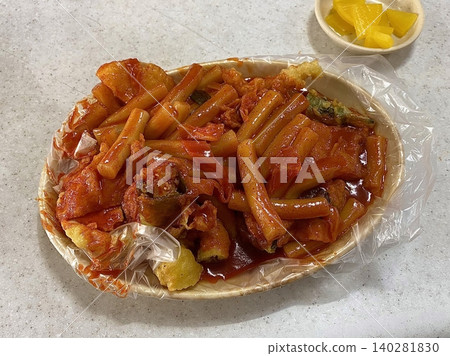 Spicy, chewy tteokbokki in rich gochujang sauce paired with savory Korean sundae, offering a perfect combination of bold heat, hearty texture, and traditional street food flavor in every bite. Spicy, chewy tteokbokki in rich gochujang sauce paired with savory Korean sundae, offering a perfect combination of bold heat, hearty texture, and traditional street food flavor in every bite. 140281830