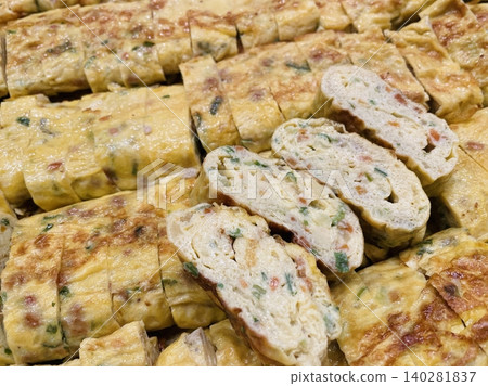 Gyeran-mari or rolled omelette in Korean cuisine is a savory banchan (side dish) made with beaten eggs mixed onion, carrot, Korean zucchini, scallions, and garlic chives. Similiar with tamagoyaki Gyeran-mari or rolled omelette in Korean cuisine is a savory banchan (side dish) made with beaten eggs mixed onion, carrot, Korean zucchini, scallions, and garlic chives. Similiar with tamagoyaki 140281837