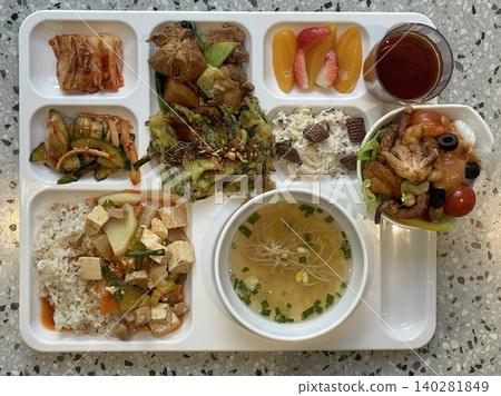 A vibrant spread of Korean food on the table, featuring various banchan (side dishes) like kimchi, pickled vegetables, and seasoned greens. Perfect for food photography, showcasing traditional Korean. A vibrant spread of Korean food on the table, featuring various banchan (side dishes) like kimchi, pickled vegetables, and seasoned greens. Perfect for food photography, showcasing traditional Korean. 140281849