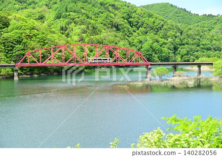 A diesel train crossing the full Kinshu Lake. A diesel train crossing the full Kinshu Lake. 140282056