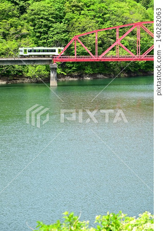 A diesel train crossing the full Kinshu Lake. A diesel train crossing the full Kinshu Lake. 140282063