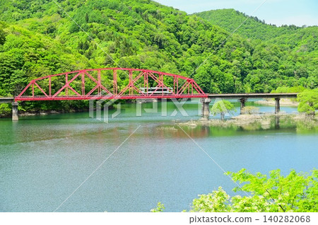 A diesel train crossing the full Kinshu Lake. A diesel train crossing the full Kinshu Lake. 140282068
