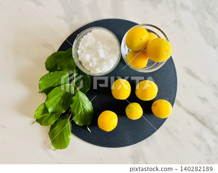 Ingredients and preparation for making pickled plums Ingredients and preparation for making pickled plums 140282189