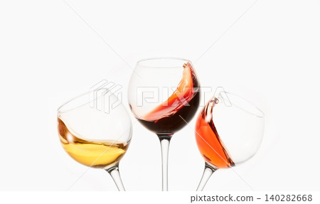 White, rose, red wine splashes, diagonal waves in glasses. White, rose, red wine splashes, diagonal waves in glasses. 140282668