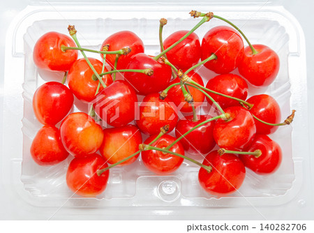 Cherries (Sato Nishiki variety) in a pack [White background, cutout] 140282706