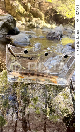 Stream fishing in a clear stream Stream fishing in a clear stream 140282721