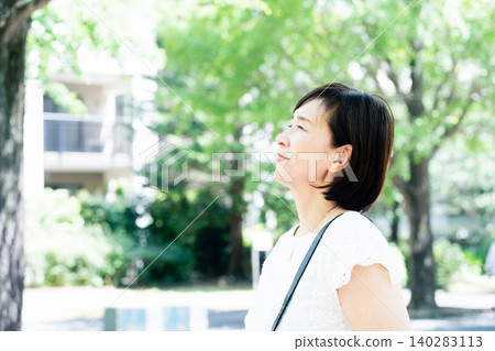 middle-aged women commuting to work middle-aged women commuting to work 140283113