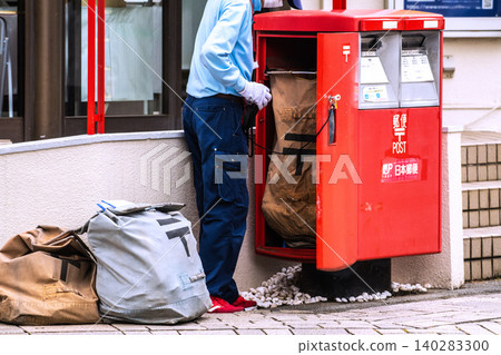 A cityscape of Yokohama, Japan: An elderly man collecting mail from a mailbox... A cityscape of Yokohama, Japan: An elderly man collecting mail from a mailbox... 140283300