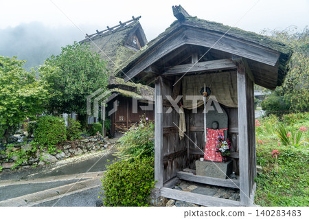 Rainy Miyama thatched-roof village 140283483