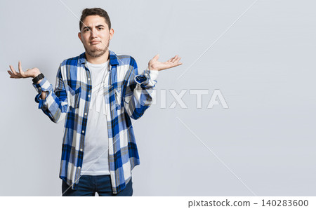 Man spreading palms, feeling clueless and uncertain, man spreading hands bewildered isolated Man spreading palms, feeling clueless and uncertain, man spreading hands bewildered isolated 140283600