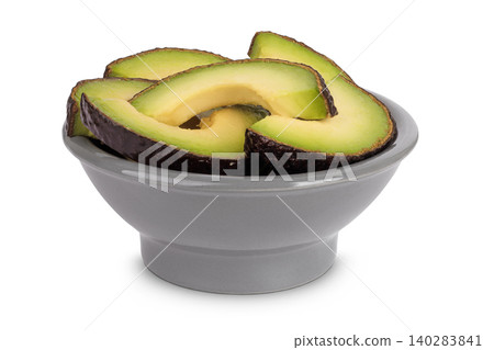 avocado slices in ceramic bowl isolated on white background close up avocado slices in ceramic bowl isolated on white background close up 140283841