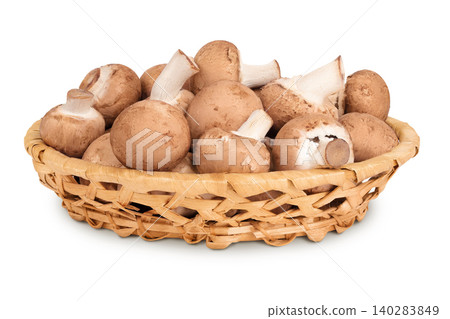 Brown champignon mushroom in a wicker basket isolated on white background Brown champignon mushroom in a wicker basket isolated on white background 140283849