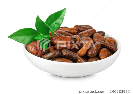 cocoa beans in ceramic bowl isolated on white background. cocoa beans in ceramic bowl isolated on white background. 140283923