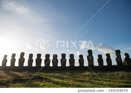 Peaceful majestic moai statue silhouette stands on easter island chile Peaceful majestic moai statue silhouette stands on easter island chile 140284070