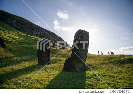 Peaceful ancient moai statue stands on easter island chile hillside Peaceful ancient moai statue stands on easter island chile hillside 140284071