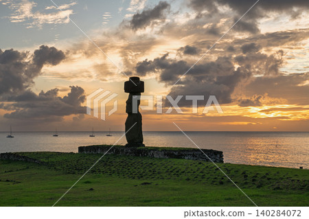 Serene moai statue on easter island chile overlooks majestic sunset ocean Serene moai statue on easter island chile overlooks majestic sunset ocean 140284072