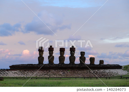 Majestic moai statue rests on peaceful easter island chile beneath bright moon Majestic moai statue rests on peaceful easter island chile beneath bright moon 140284073