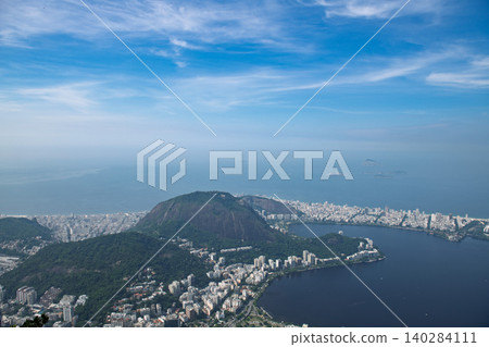 Breathtaking panoramic aerial view of majestic mountain and city overlooking ocean bay under blue sky in rio de janeiro 140284111