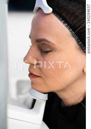 Woman undergoing facial treatment at a skincare clinic in a modern setting Woman undergoing facial treatment at a skincare clinic in a modern setting 140284637
