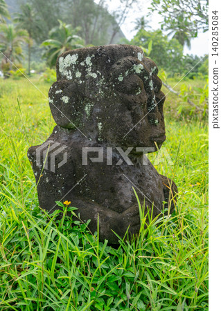 Ancient tiki statue near Coral Garden Beach on Huahine, French Polynesia Ancient tiki statue near Coral Garden Beach on Huahine, French Polynesia 140285084
