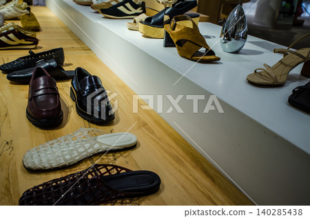 Shoes and sandals displayed in a shoe shop 140285438