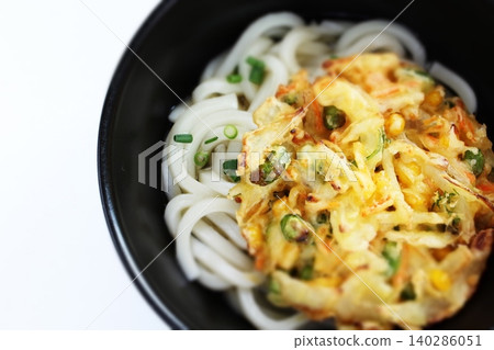 Vegetable tempura udon with edamame, carrots, and other vegetables. Vegetable tempura udon with edamame, carrots, and other vegetables. 140286051