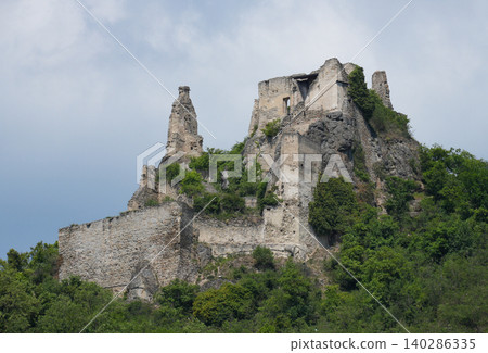Durnstein Castle ruins in Krems, Austria on green hill representing historic architecture and cultural heritage 140286335