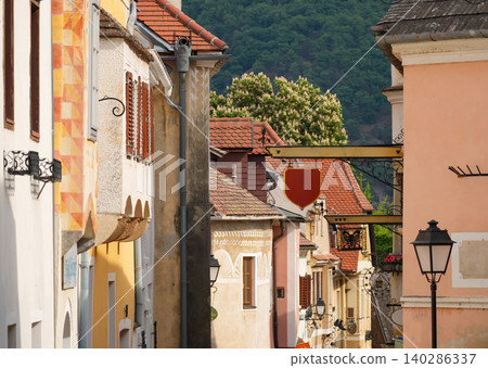 Colorful street in Krems, Austria with historic architecture and green hills Colorful street in Krems, Austria with historic architecture and green hills 140286337