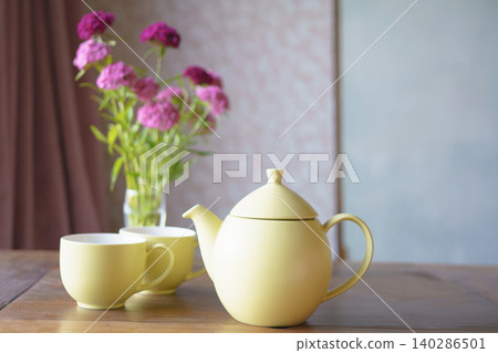 Flowers and tea set on the table Flowers and tea set on the table 140286501