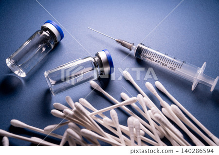 A hygienic setup representing health using cotton swabs and syringes. A hygienic setup representing health using cotton swabs and syringes. 140286594