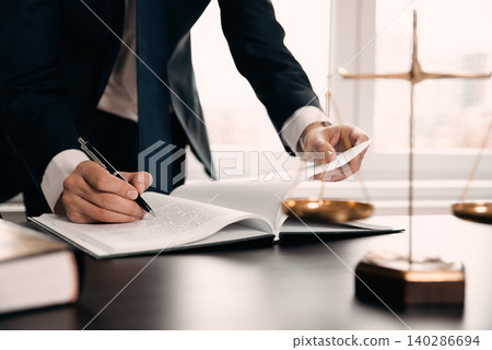 Wooden gavel on table. Attorney working in office Wooden gavel on table. Attorney working in office 140286694